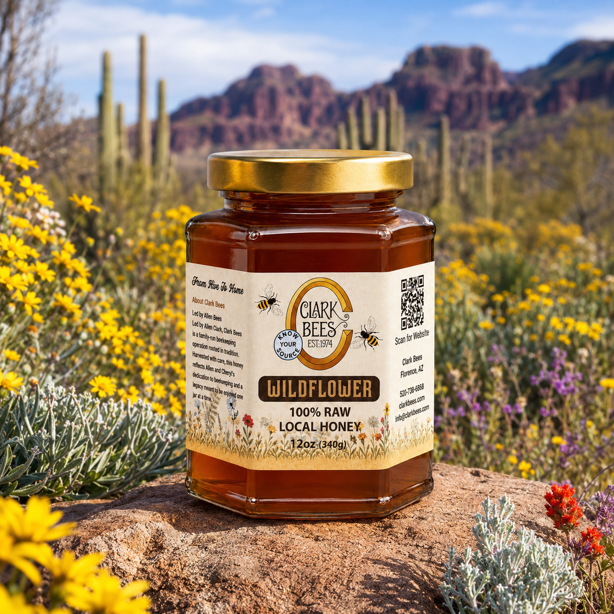 Jar of Clark Bees Wildflower Honey in a desert setting with cacti and flowers.
